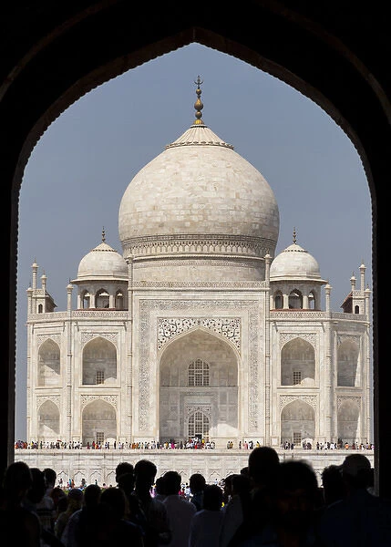 Asia, India. Taj Mahal entry gate, the Royal Gate with people in silhouette