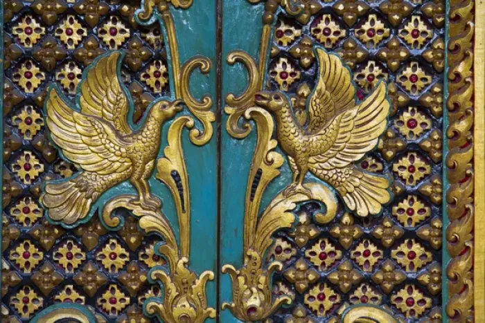 Framed Print : Asia, Indonesia, Bali. Gilded carved temple doors with symbols of birds in Bali