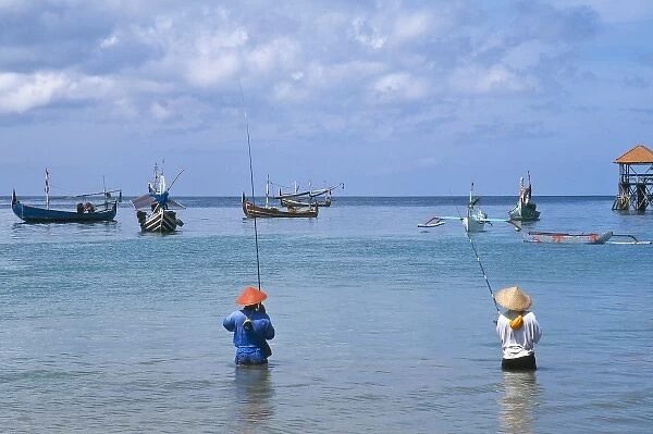 Asia, Indonesia, Bali, Jimbaran fishing village. Balinese fishing with colorful jukungs