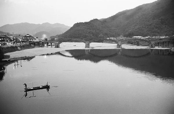 Asia, Japan, Iwakuni. Fishermen and historic bridge