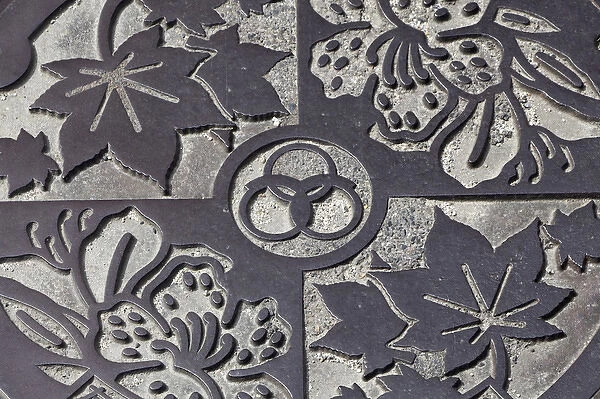 Asia, Japan, Takatori-do. Decorated manhole cover