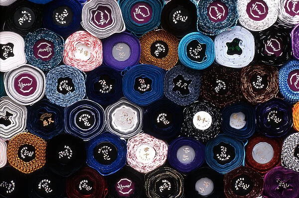 Asia, Japan, Tokyo. Close-up of end view of rolls of fabric in Akasaka district of Tokyo