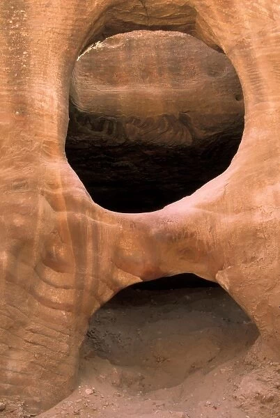 Asia, Jordan, Petra. Hole and arch in sandstone