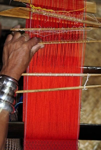 Asia, Myanmar (Burma), Lake Inle. A weaver in a Lake Inle store