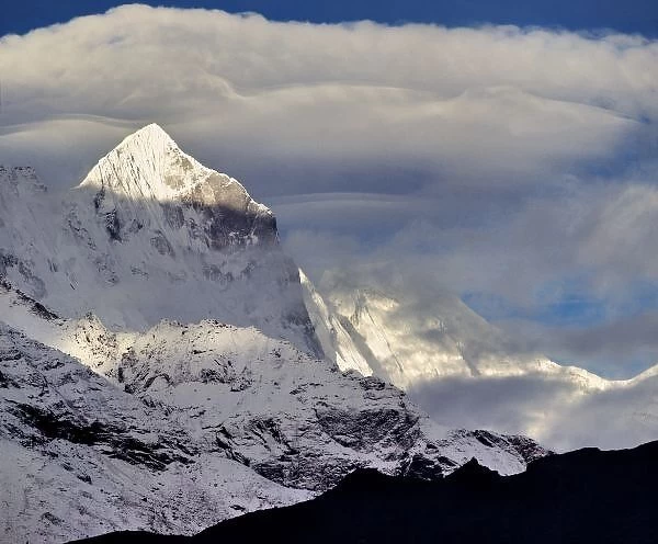 Asia, Nepal, Sagarmatha NP. Clouds collect above Kwangde Peak in the Khumbu Himalaya