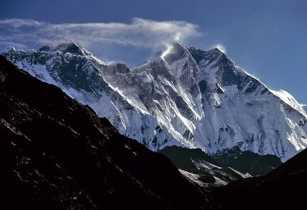 Asia, Nepal, Sagarmatha NP. Clouds swirl around Mt. Everest, Lotse and Nuptse in