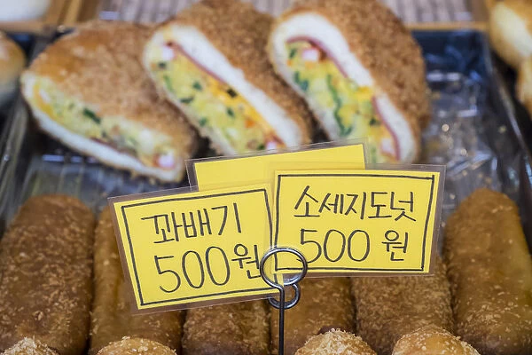 Asia, South Korea, Incheon Airport neighborhood. Street-side bakery, offering continental pastries