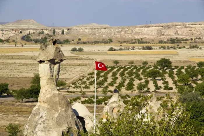 Framed Print : Asia, Turkey, Cappadocia. Turkish flag is flying over Pomegranate orchards Framed Print : Asia, Turkey, Cappadocia. Turkish flag is flying over Pomegranate orchards