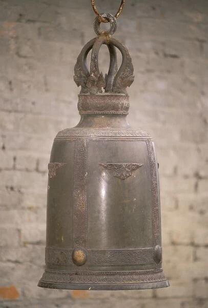 Asian, China, Yunnan Province, Xishaungbanna, Manfeilong Village. Large cast bell
