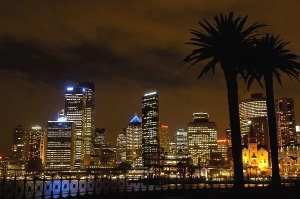 Australia. Sydney skyline at night with the Sydney Harbour in the foreground