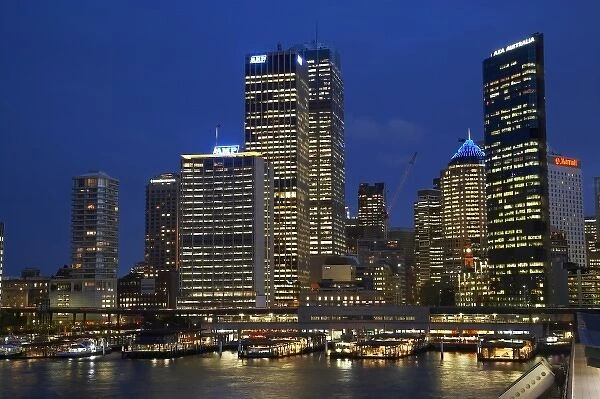 Australia, New South Wales, Sydney, Sydney Central Business District and Passenger Ferry Terminal at Night
