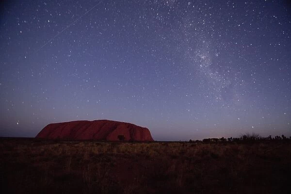 Australia, Northern Territory, Uluru-Kata Tjuta National Park. Stars circle above