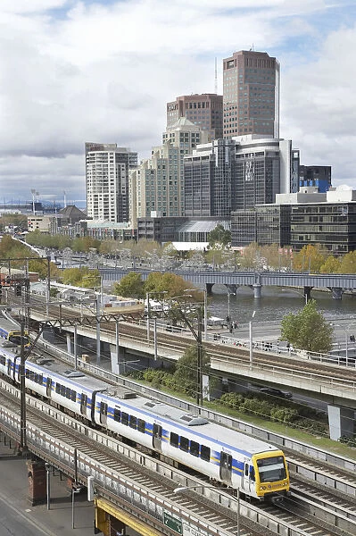 Australia, Victoria, Melbourne, Passenger Train, Yarra River and Office Blocks