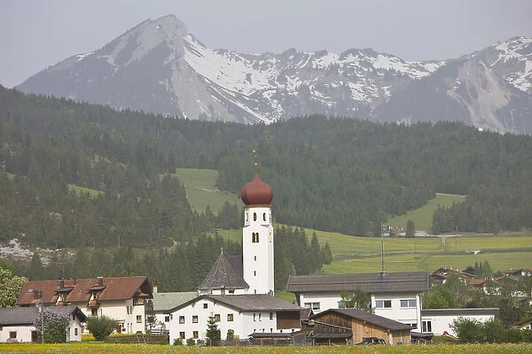 AUSTRIA, Lechtaler Alps, Heiterwang. Village view with Austrian Alps, springtime