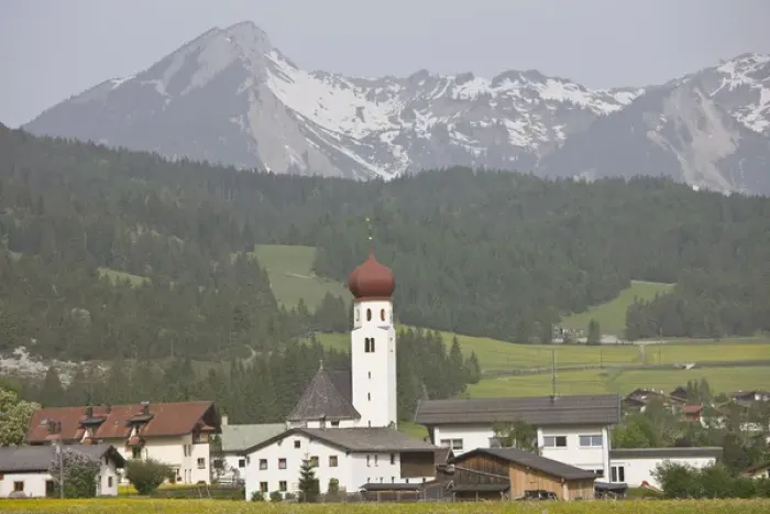 Framed Print : AUSTRIA, Lechtaler Alps, Heiterwang. Village view with Austrian Alps, springtime