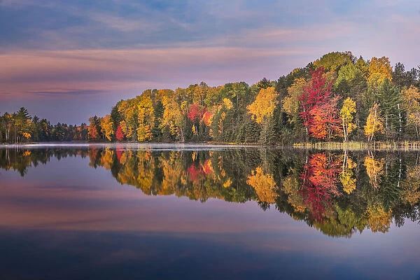 Autumn sunrise reflection on mirrored lake, Upper Peninsula of Michigan