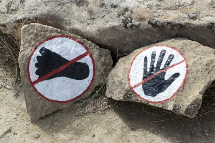 Framed Print : Azerbaijan, Qobustan. A warning to not touch or walk on the rocks at Gobustan National