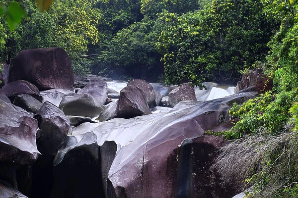 The Babinda Boulders is a fast-flowing river surrounded by smooth boulders and a