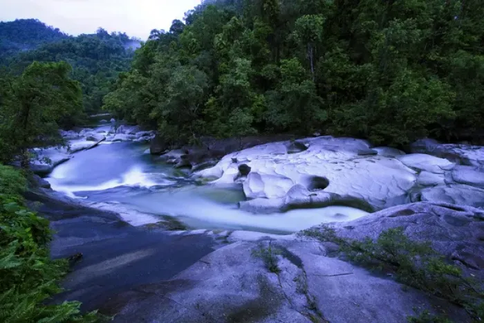 Framed Print : The Babinda Boulders is a fast-flowing river surrounded by smooth boulders and a Framed Print : The Babinda Boulders is a fast-flowing river surrounded by smooth boulders and a
