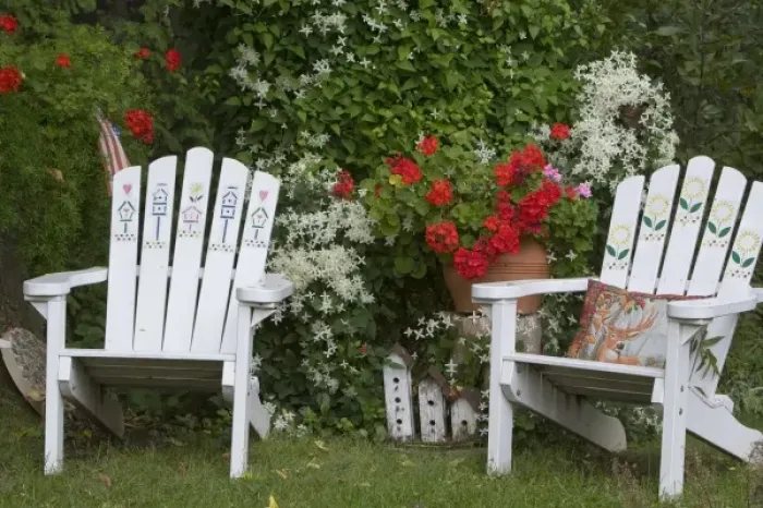 Framed Print : Backyard garden display with Adirondak chairs