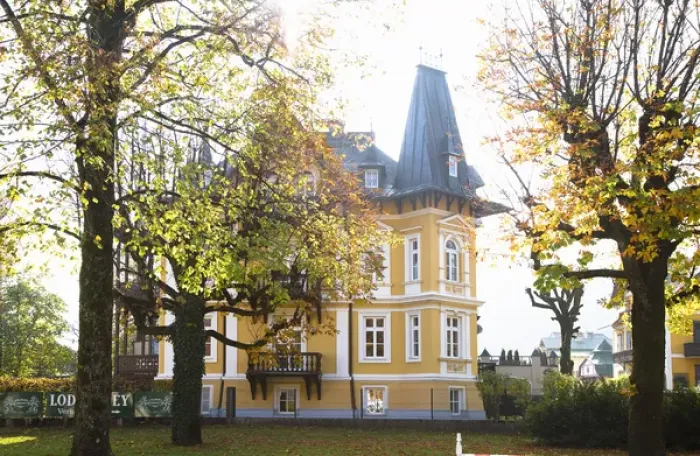 Framed Print : Bad Ischl, Upper Austria, Austria - Low angle view of a yellow, old world style home Framed Print : Bad Ischl, Upper Austria, Austria - Low angle view of a yellow, old world style home