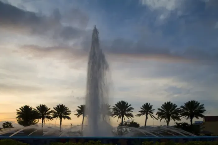 Framed Print : Bahamas, Grand Bahama Island, Freeport, Setting sun silhouettes fountains and palm Framed Print : Bahamas, Grand Bahama Island, Freeport, Setting sun silhouettes fountains and palm