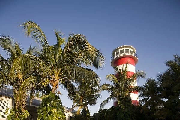 Bahamas, Grand Bahama Island, Freeport, Setting sun lights lighthouse exterior