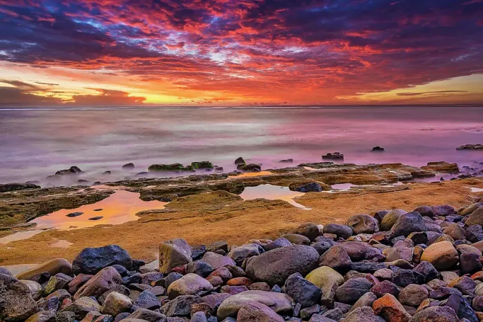 Framed Print : Bali's sunsets are often considered postcard-perfect, with their stunning colors and breathtaking scenery. Here is a Black and White at sunset high tide