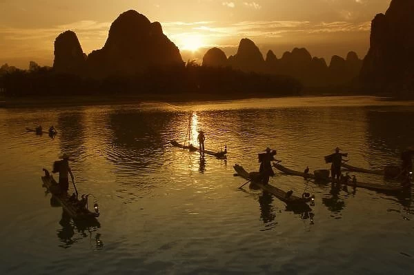 Bamboo rafts on the Li River at sunset, Yangshuo, Guangxi Province, China
