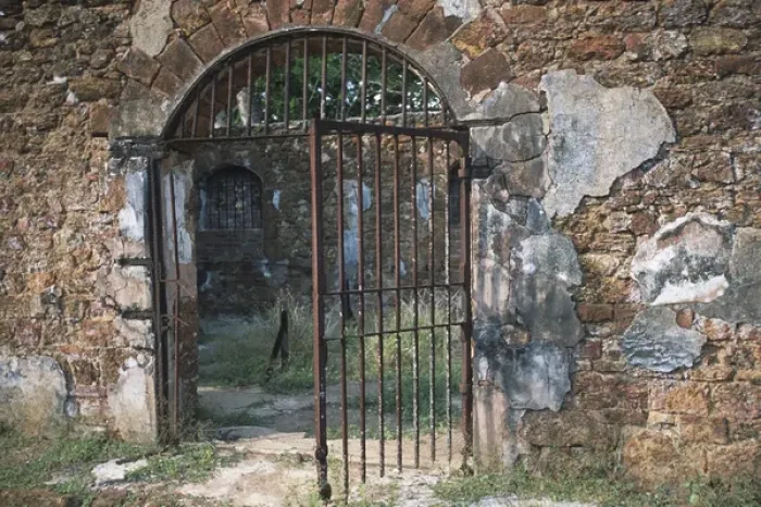 Framed Print : Barred Iron Gate to Prison Complex; Ile Royale; Devils Islands, French Guiana Framed Print : Barred Iron Gate to Prison Complex; Ile Royale; Devils Islands, French Guiana