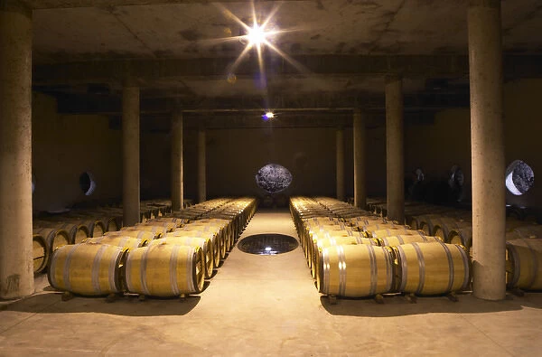 The barrel aging cellar, with a hole in the wall and a hole in the floor to show the soil