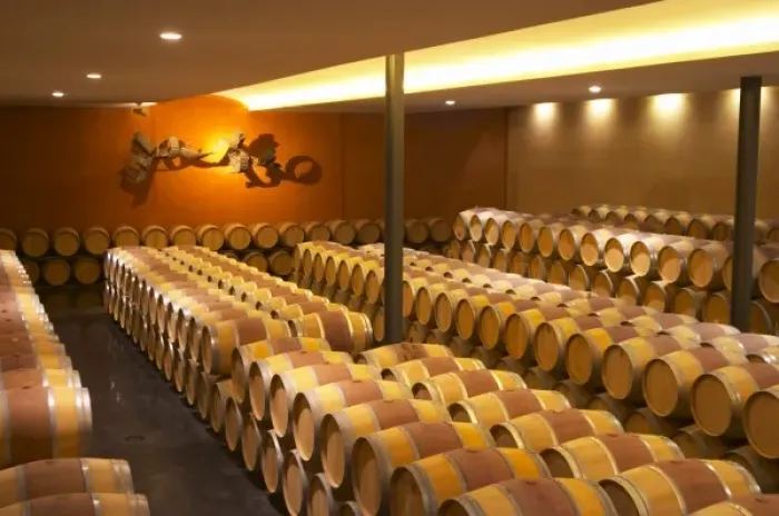 Framed Print : The barrel aging cellar with a sculpture on the far end wall symbolising the flight Framed Print : The barrel aging cellar with a sculpture on the far end wall symbolising the flight