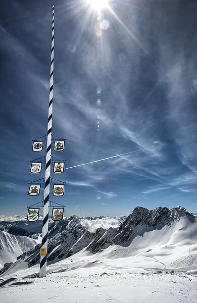 Bavarian Alps, Zugspitze, Germany and Maypole in winter vertical