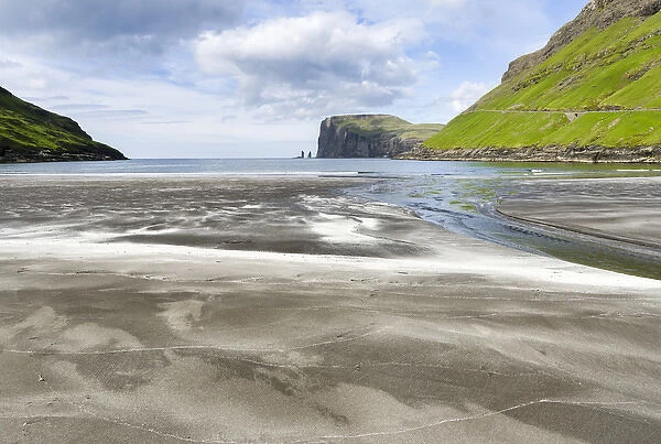 Beach at Tjornuvik. In the background the island Eysturoy with the iconic sea stacks Risin