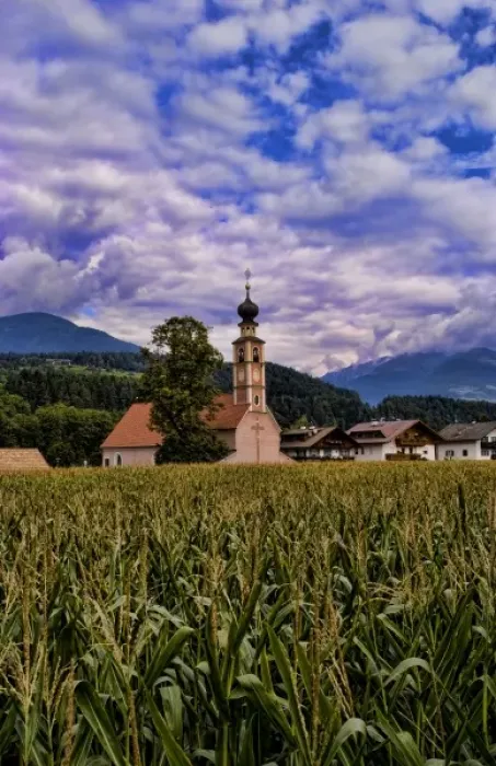 Framed Print : Beautiful church of St Lorenzo di Sebato with corn fields in the Italian Dolomites