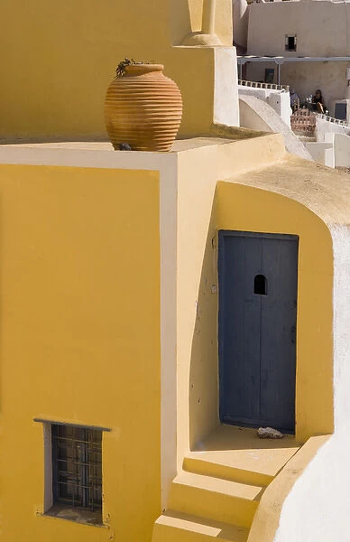 The beautiful colorful buildings on the mountain cliffs of the small isolated romantic city of Oia