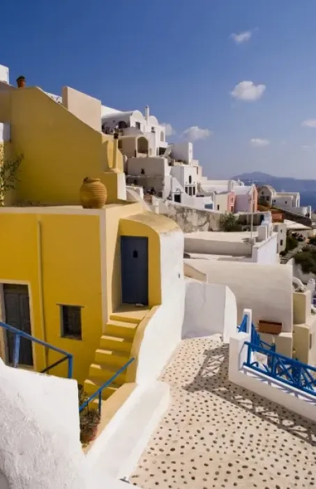 Framed Print : The beautiful colorful buildings on the mountain cliffs of the small isolated romantic city of Oia Framed Print : The beautiful colorful buildings on the mountain cliffs of the small isolated romantic city of Oia