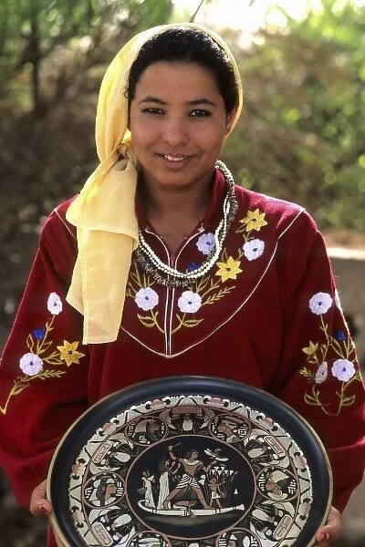 Beautiful local young woman selling items to tourists in Sakkara Egypt (MR)