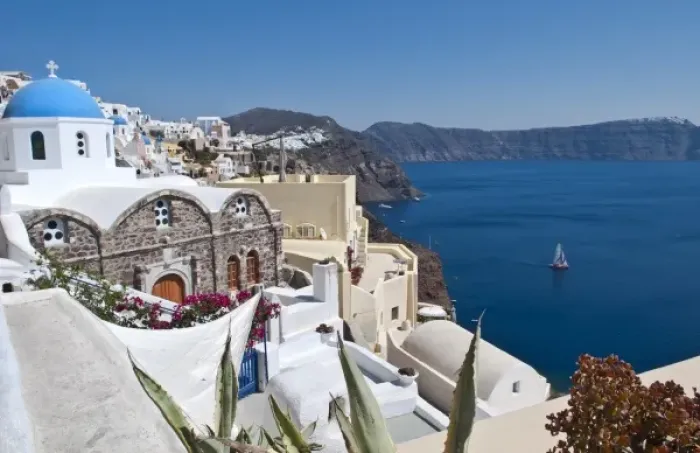 Framed Print : Beautiful Oia in Greek Island of Santorini Greece and the white buildings looking Framed Print : Beautiful Oia in Greek Island of Santorini Greece and the white buildings looking