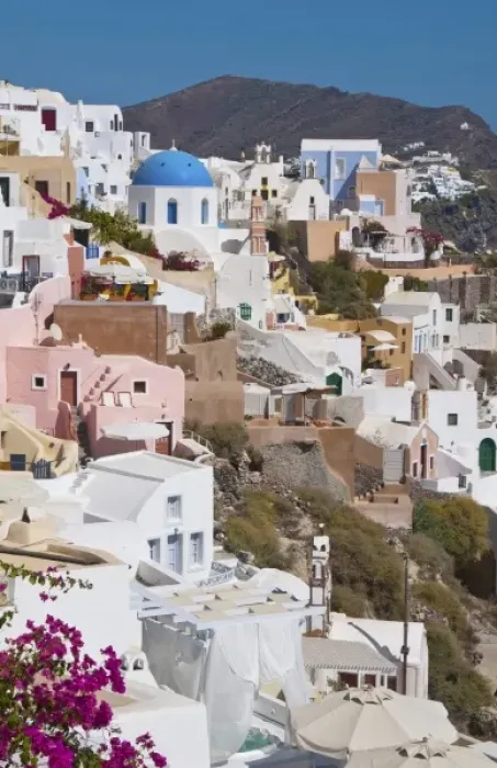 Framed Print : Beautiful Oia in Greek Island of Santorini Greece and the white buildings looking Framed Print : Beautiful Oia in Greek Island of Santorini Greece and the white buildings looking