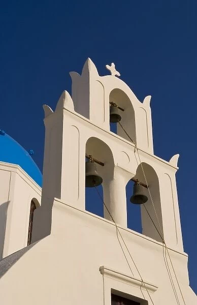 Beautiful village of Oia with a bell tower in front of the church, Santorini