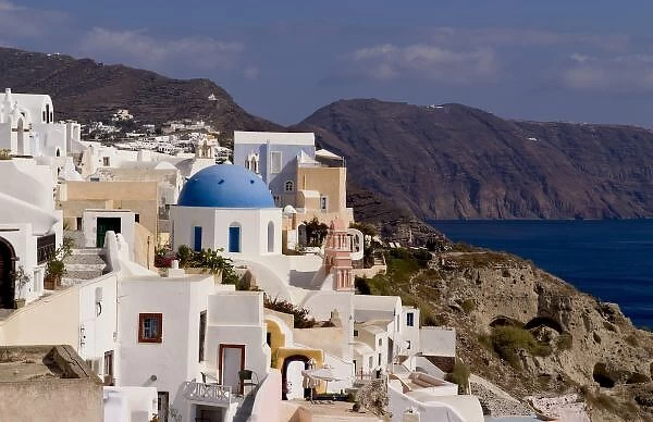 Beautiful village of Oia with white buildings looking down into the water, Santorini
