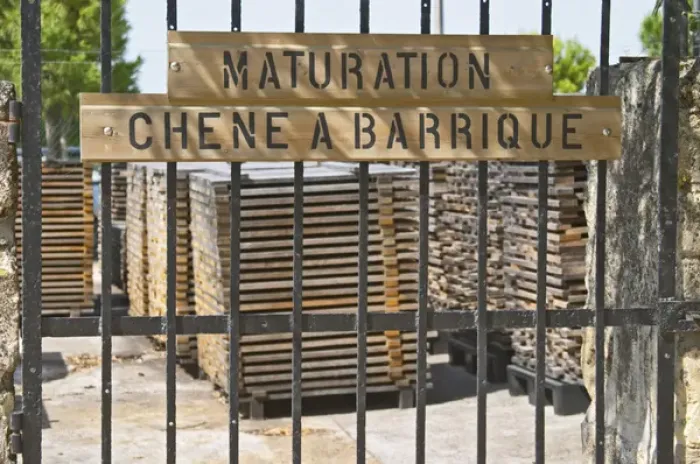 Framed Print : Bel Air stores its own oak staves to be used later for making barrels, the sign says Framed Print : Bel Air stores its own oak staves to be used later for making barrels, the sign says