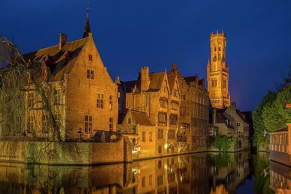 Belgium, Bruges. Buildings reflect in canal at twilight