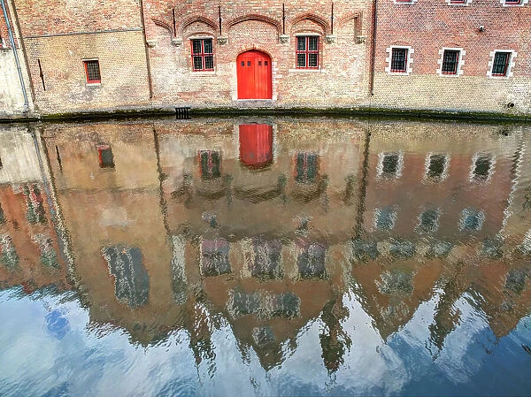 Belgium, Bruges. Reflections of medieval buildings along canal