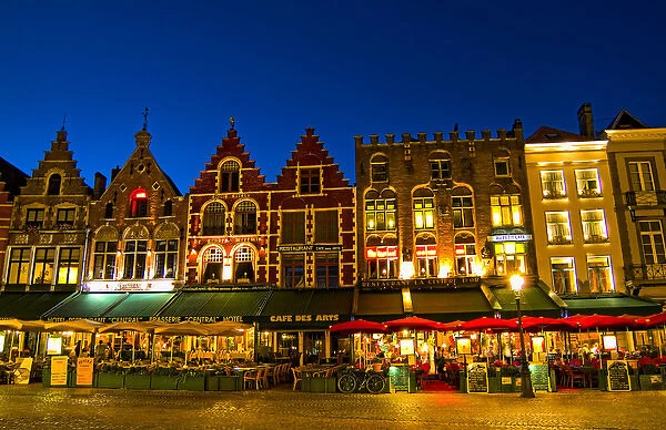 Belgium night photo of colorful cafes in Marketplace in downtown Bruges Belgium