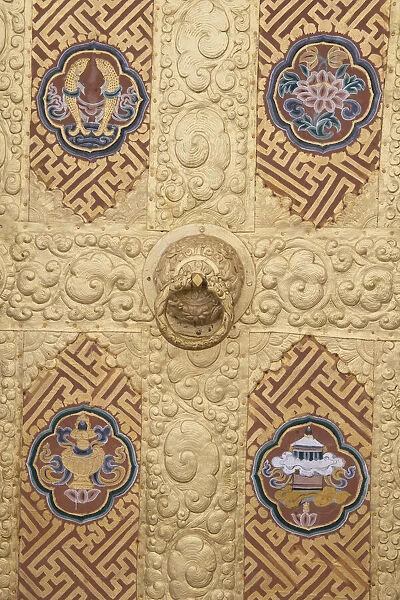 Bhutan. Ornate golden door detail