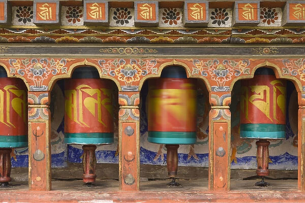 Bhutan, Paro. Spinning prayer wheel at the Rinpung Dzong