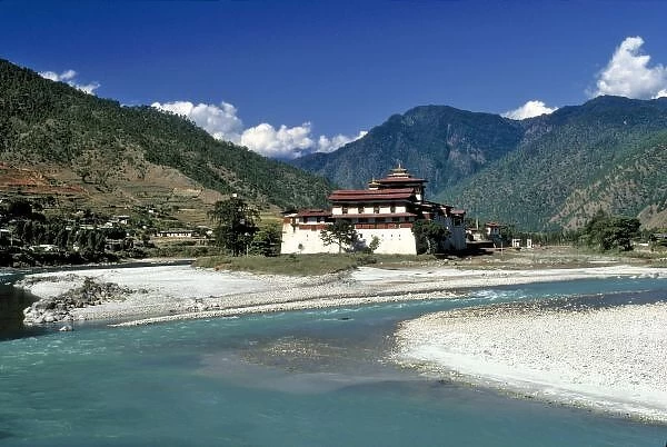 Bhutan, Punaka. The Mo Chhu River flows past Punaka Dzong in Bhutan