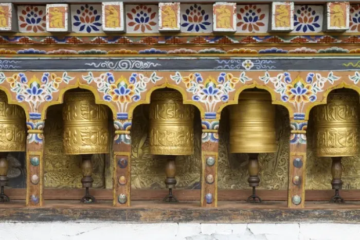 Framed Print : Bhutan. Spinning prayer wheels along a temple wall Framed Print : Bhutan. Spinning prayer wheels along a temple wall